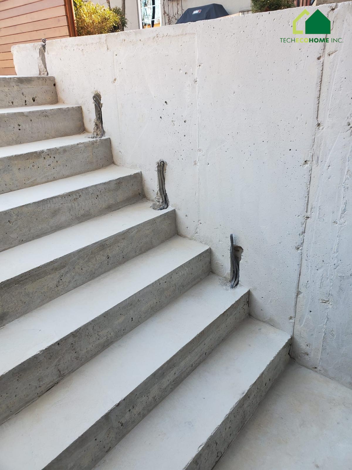Concrete porch and stairs at a residential entry