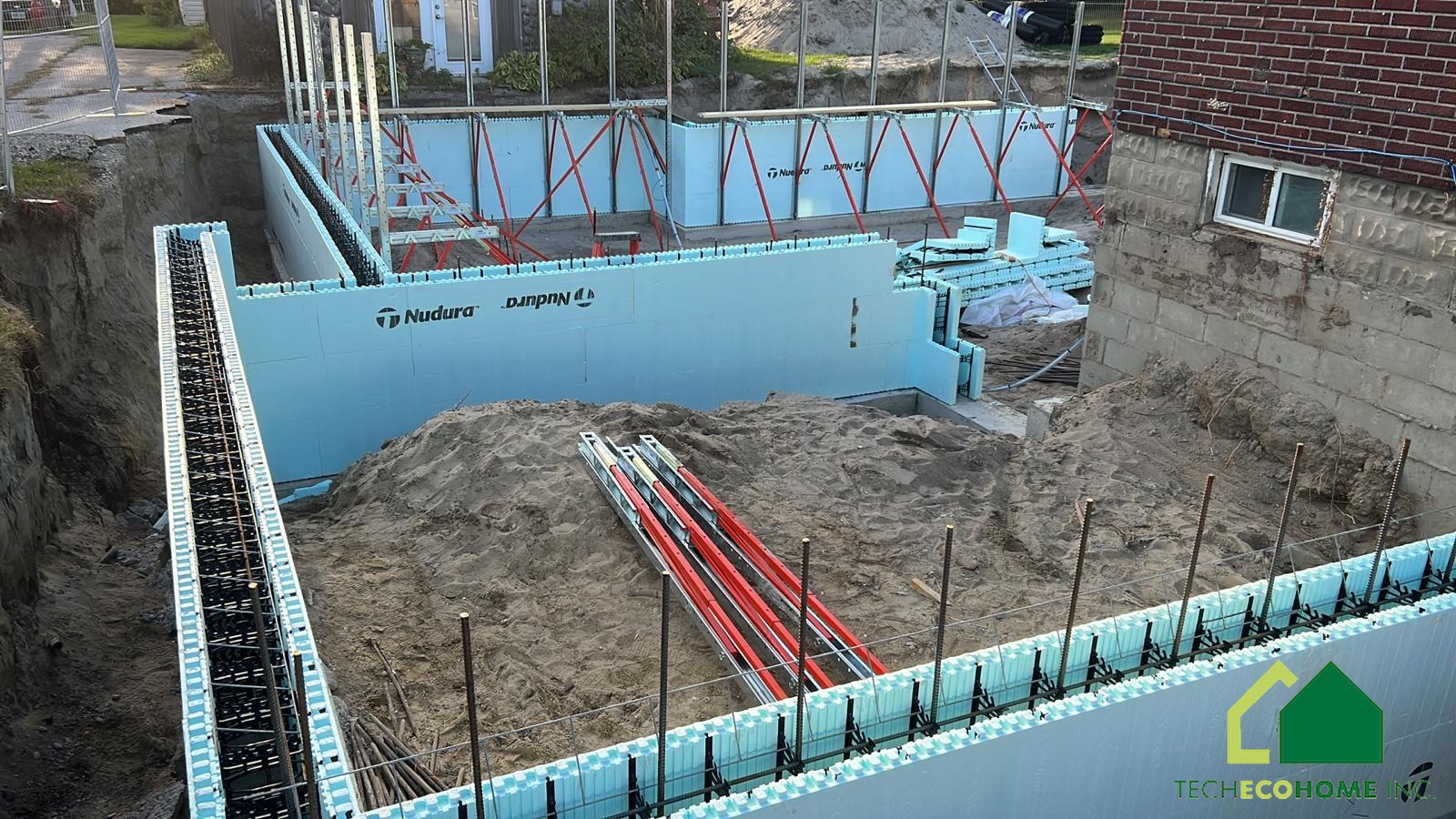 ICF wall course with rebar and bracing before concrete placement