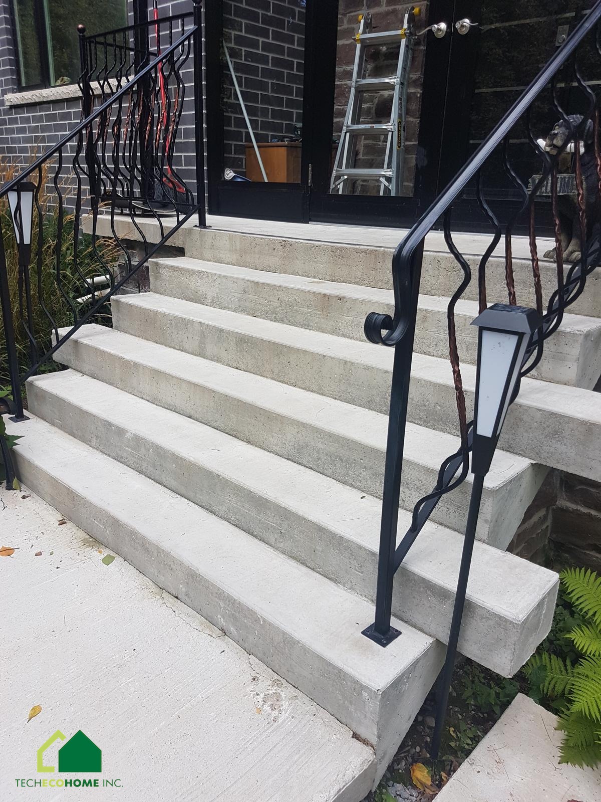 Formed concrete steps and landing at a residential entrance