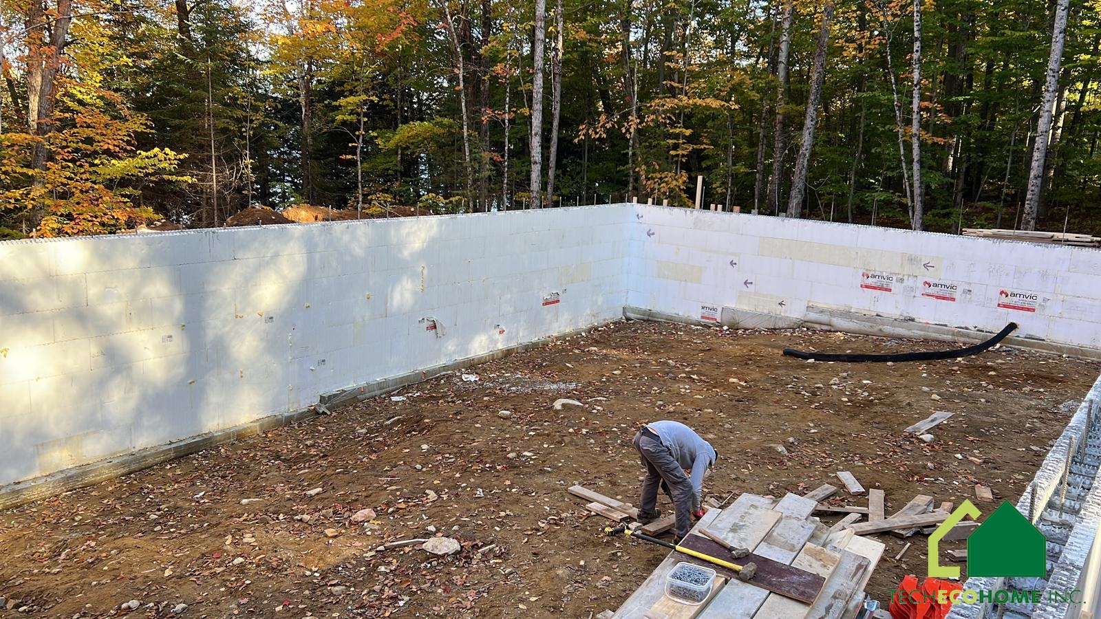 Completed ICF foundation walls around an excavated basement area